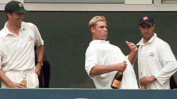 Australian bowler Shane Warne gestures to the crowd at Old Trafford, Manchester in his cricketing heyday.