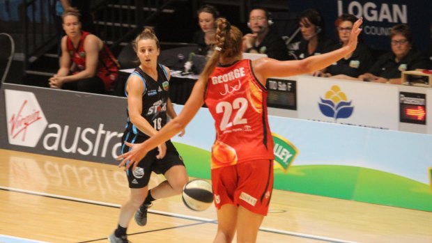 SEQ Stars' point guard Lauren Mansfield brings the ball up against Townsville, on her way to 17 points, seven rebounds and eight assists on her birthday.