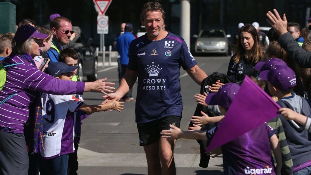 Bellamy is greeted by fans during a Storm open training session on Wednesday.