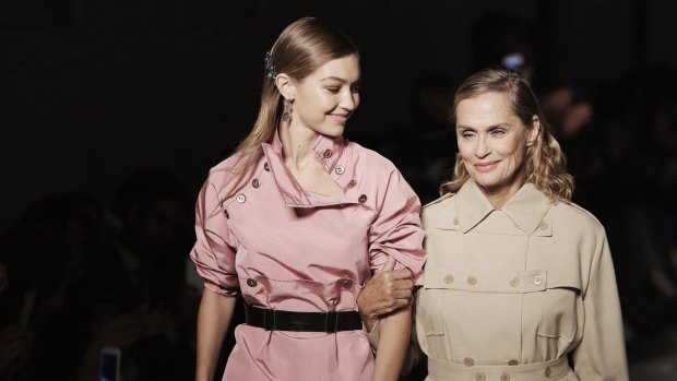 Models Gigi Hadid and Lauren Hutton walk the runway at the Bottega Veneta show during Milan Fashion Week.