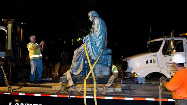 A monument dedicated to US Supreme Court Chief Justice Roger Brooke Taney, the author of the infamous Dred Scott decision that upheld slavery, is removed from outside the Maryland State House in Annapolis on Friday morning.