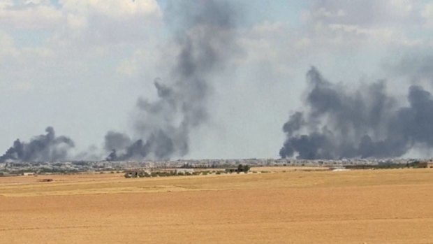 Smoke rising from the city of Manbij, Syria as US-backed fighters closed all major roads leading to the northern Syrian town, a stronghold of the Islamic State group.