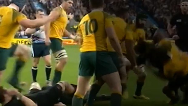 Accused: David Pocock's foot hovers over Richie McCaw's head. 