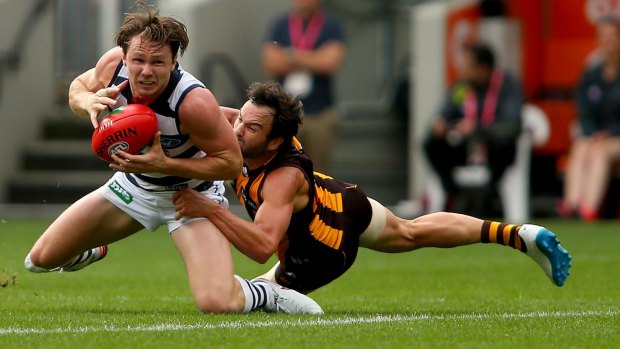 New Cat Patrick Dangerfield is under pressure from Jordan Lewis during the Easter Monday clash Hawthorn and Geelong at the MCG.