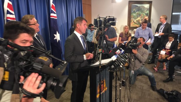 Premier Mike Baird at Tuesday's media conference announcing the reversal. 
