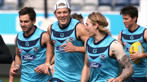 Crook: Tom Stewart, second from right, left Geelong training early on Monday morning.