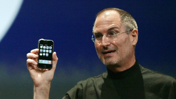 Apple CEO Steve Jobs demonstrates the new iPhone in 2007.