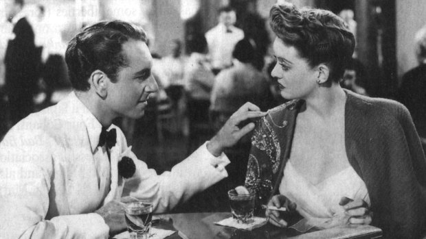Bette Davis (with that cape) and Paul Henreid in 'Now Voyager'.