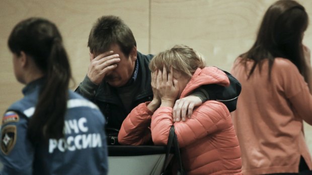 Relatives and the friends of those on the Metrojet flight that crashed in Egypt react while gathering to grieve at a hotel near St Petersburg's Pulkovo airport.