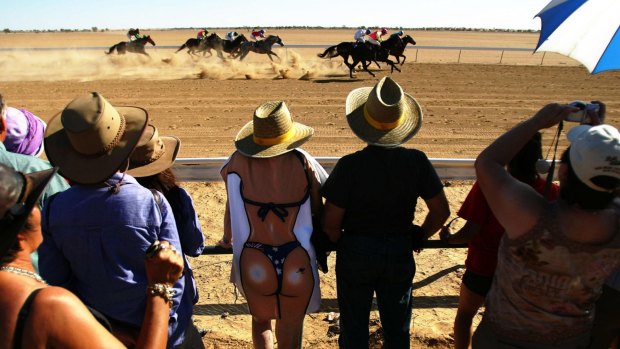 Horses race in Birdsville at an iconic outback event, started in 1882, that draws people from everywhere to the remote speck on the eastern edge of the Simpson Desert.