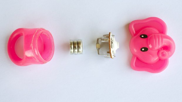 A children's toy ring that falls apart very easily exposing the 3 batteries inside, a potential choking hazard.