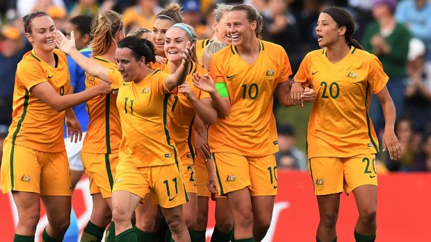 Lapping it up: Lisa De Vanna's celebrates a goal against Brazil in front of nearly 17,000 fans in Penrith.