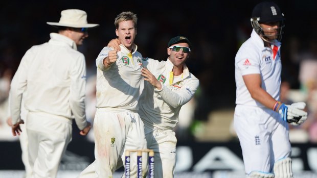 Changing of the guards: Steve Smith takes Matt Prior’s wicket in England last year.