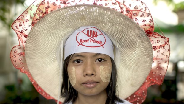 A protester shows her opposition to the return of Rohingyas in Yangon, Myanmar. 