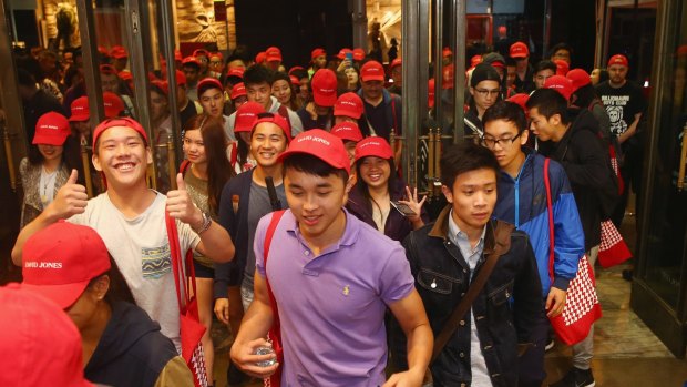 A large crowd piles into David Jones just after the announcement of the start of the Boxing Day sales at the Castlereagh Street store in Sydney.