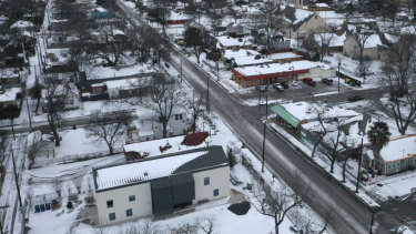 Snow and ice grips a neighbourhood in Austin. Day six of the statewide freeze and still millions of Texans are without power. 