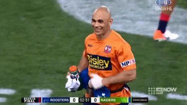 Roosters trainer Travis Touma saw the funny side after being hit with the ball in the NRL grand final. Raiders fans didn't.