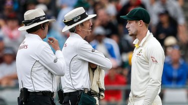 Cameron Bancroft is questioned by umpires Richard Illingworth (left) and Nigel Llong on that famoyus day in Cape Town.