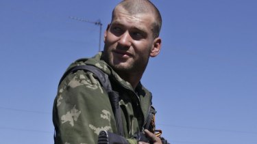 A pro-Russian rebel holds ammunition in the village of Hrabske, eastern Ukraine.