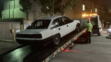 A Holden VN Commodore being impounded by police on the weekend. 