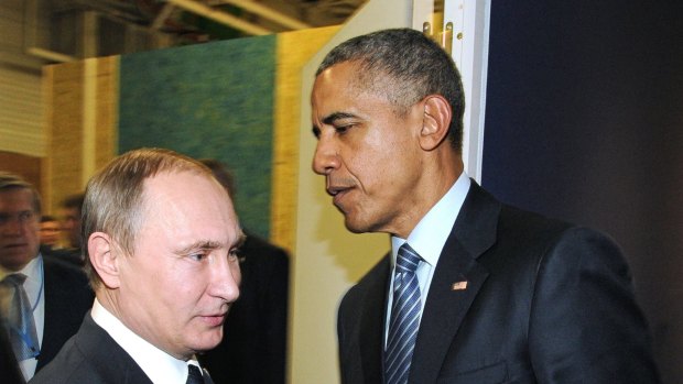 Russian President Vladimir Putin and US President Barack Obama shake hands at the COP21 UN Conference on Climate Change in Paris.