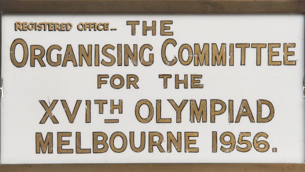 Sign from the 1956 Melbourne Olympics, gilt on perspex in metal frame, 28x15cm. Estimate: $6000-7000.