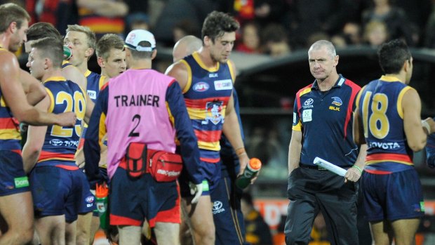 Adelaide coach Phil Walsh with his players in the round-12 match against Hawthorn.