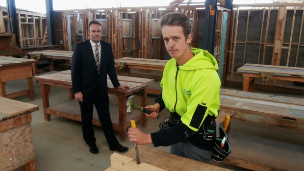 Quality matters: Master Builders Association ACT deputy executive director, Michael Hopkins, left, with first-year apprentice builder, Henry Pittar, from Belconnen. Henry says nothing is as satisfying as knowing that you have a done job to the best of your ability. 