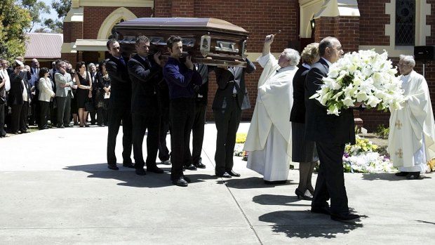 Mr Menegazzo's coffin is carried at his funeral in Werribee. It was the same church he and his wife Angela were married 40 years earlier.