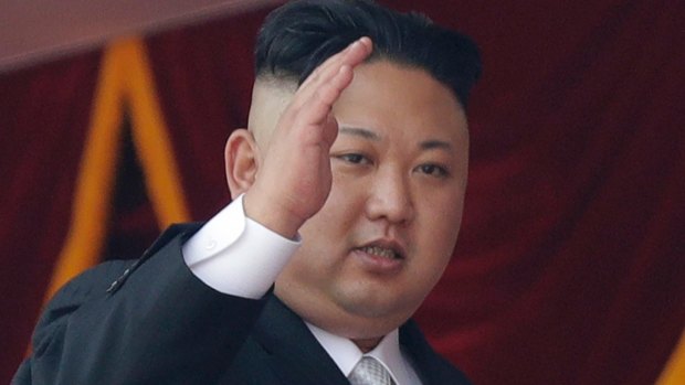 North Korean leader Kim Jong-un waves during a military parade in Pyongyang.