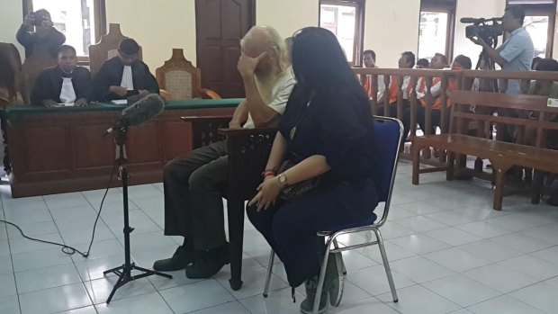 Australian paedophile Robert Ellis prays before his sentencing in Denpasar District Court on Tuesday.