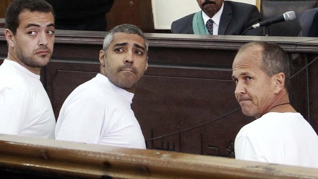 Al-Jazeera journalists Baher Mohamed, Mohammed Fahmy, and Peter Greste appear in court in March, 2014.
