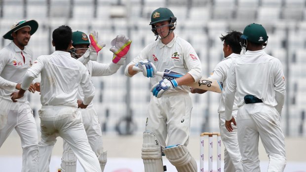 Extra duties: Australia are considering giving Peter Handscomb the wicketkeeping gloves.