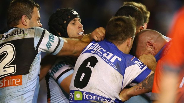 Dogfight: Wade Graham and Michael Ennis scuffle with Josh Reynolds and David Klemmer.