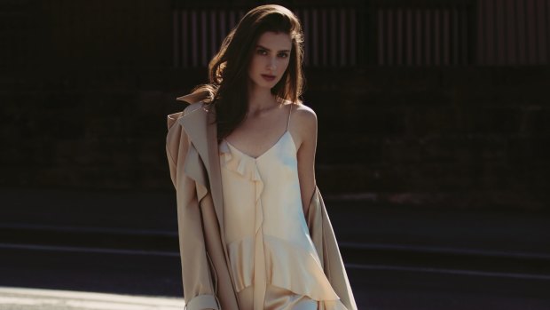 Dion Lee trench coat, $2490. Jonathan Simkhai “Ruffle-Trimmed” silk-satin dress, $1398, from Matches Fashion. 
