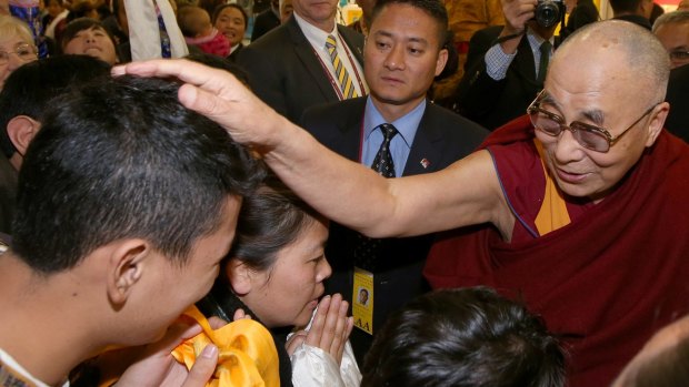 Attracts a crowd: The Dalai Lama in Sydney on Thursday.