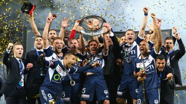 Grand champions: Melbourne Victory celebrate winning the A-League grand final.