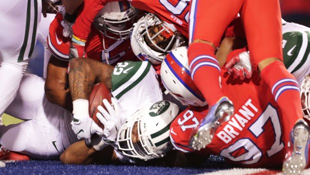 Stacks on: Matt Forte gets under a tangle of bodies for a touchdown.