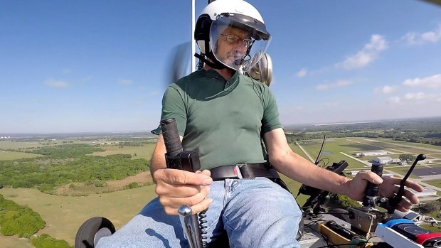 Doug Hughes flies his gyrocopter near the Wauchula Municipal Airport in Wauchula, Florida.