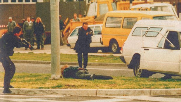 Hitman Stephen Asling lies prostrate as Special Operations Group members approach during Melbourne's underworld wars. The SOG trains for hundreds of violent scenarios.