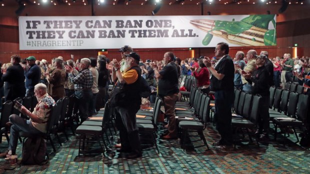 NRA members applaud a speech during their annual meeting in April.