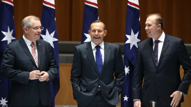 Cape York time: Social Services Minister Scott Morrison, Prime Minister Tony Abbott and Immigration Minister Peter Dutton joke while waiting for a meeting. 