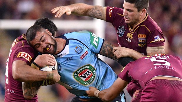 Man-mountain: Andrew Fifita carts the ball up.