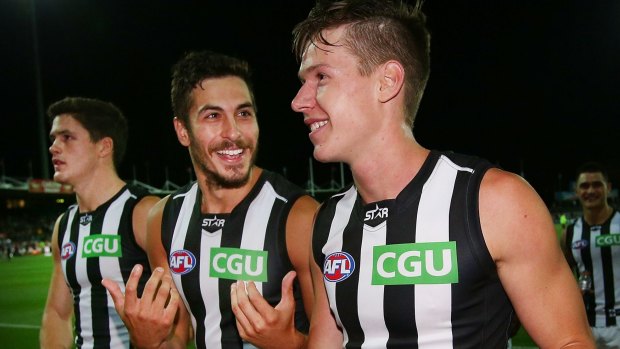 Patrick Karnezis (centre) and Tom Langdon (right) celebrate a NAB Challenge win in February.