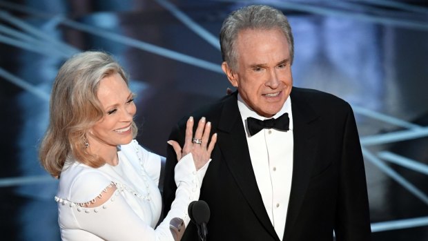 'I thought he was joking': Faye Dunaway, left, and Warren Beatty before announcing the Oscar for best picture.
