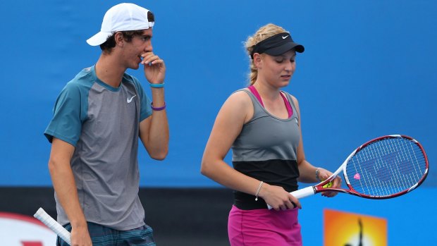Caught in the middle: Thanasi Kokkinakis and Donna Vekic at the 2014 Australian Open.