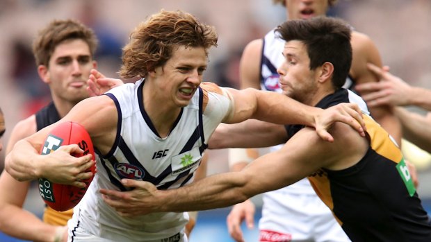 Nat Fyfe breaks clear with another possession against the Tigers last year.