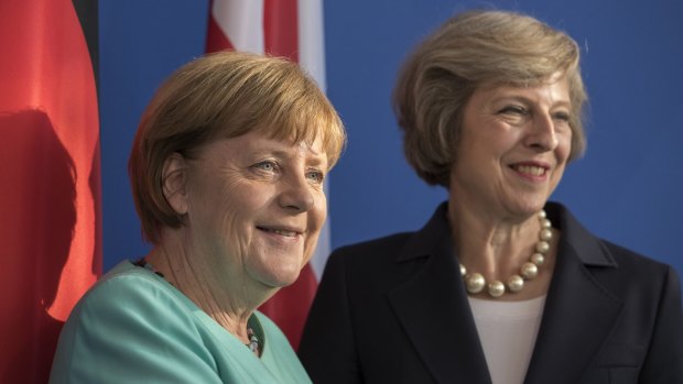 The calmness of German Chancellor Angela Merkel (left) and new British Prime Minister Theresa May steadied the market after Brexit.