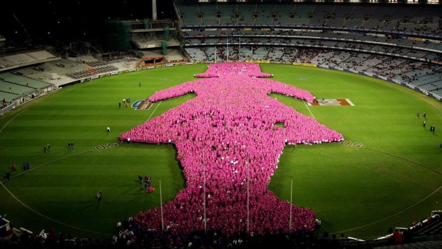 The Pink Lady breast cancer awareness campaign has been part of the footy fixture for years. Here, thousands of women gathered on the MCG in 2005 to show their support.