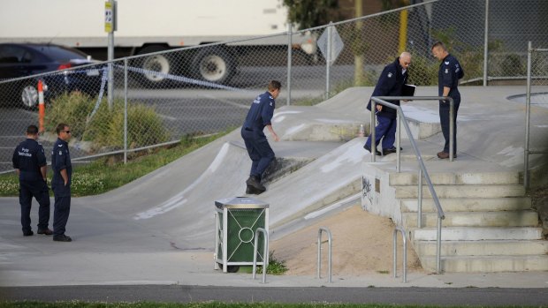 Police search the skate park in  Northcote the day after Tyler Cassidy was shot dead in 2008.